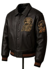 Black leather jacket with gold patches on a white background