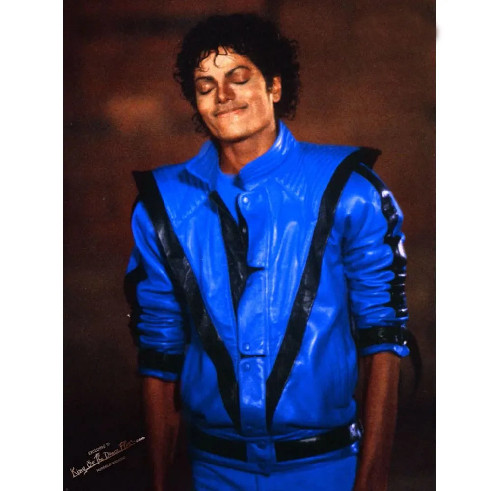 Person wearing a blue jacket with black accents against a brown background