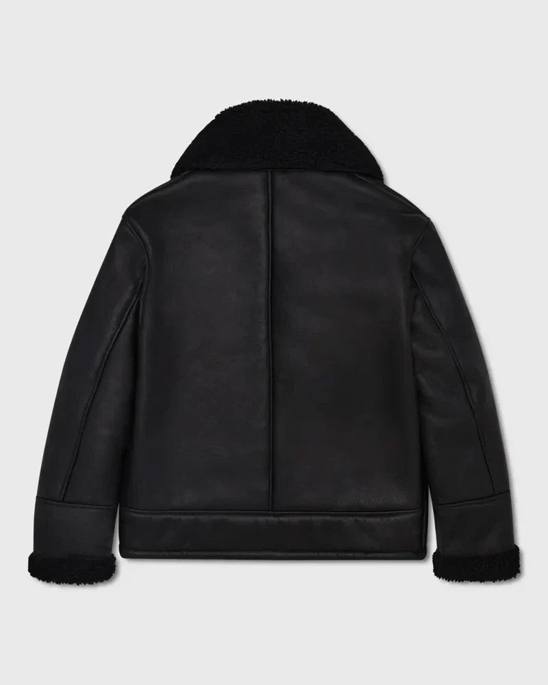 Black leather jacket with fur trim on a light gray background
