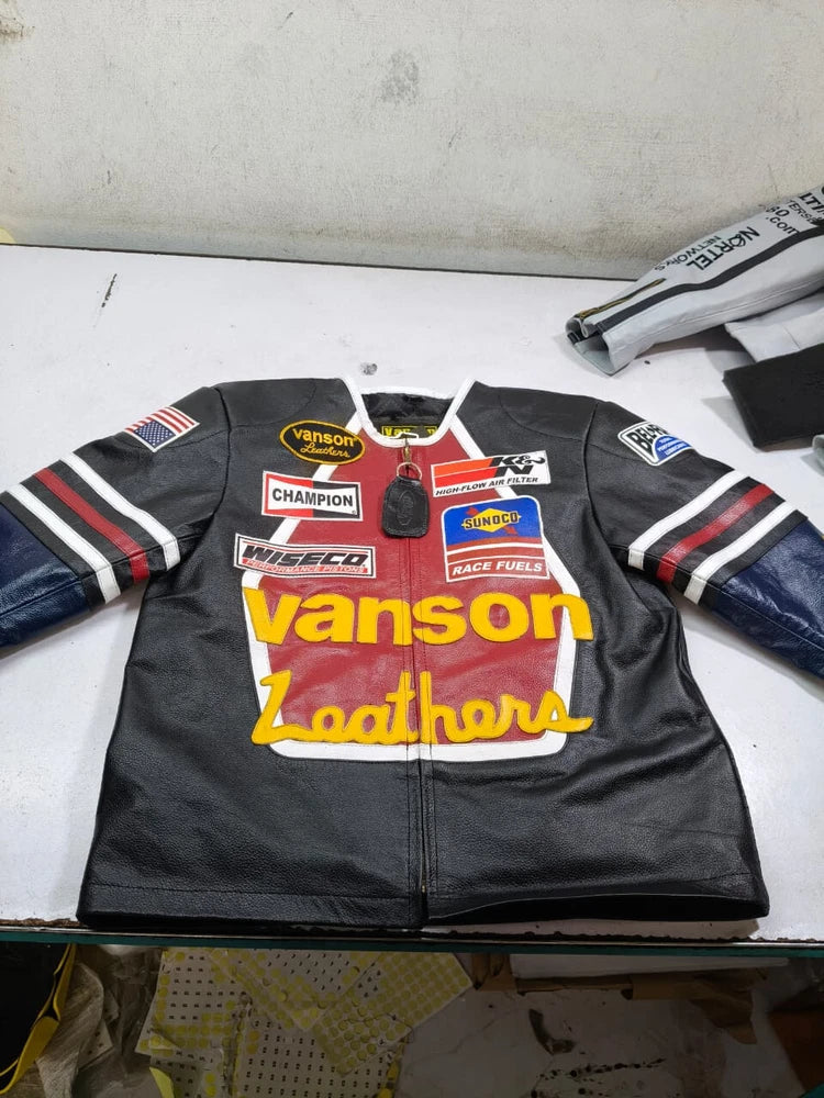 Black leather jacket with visible branding on a white surface