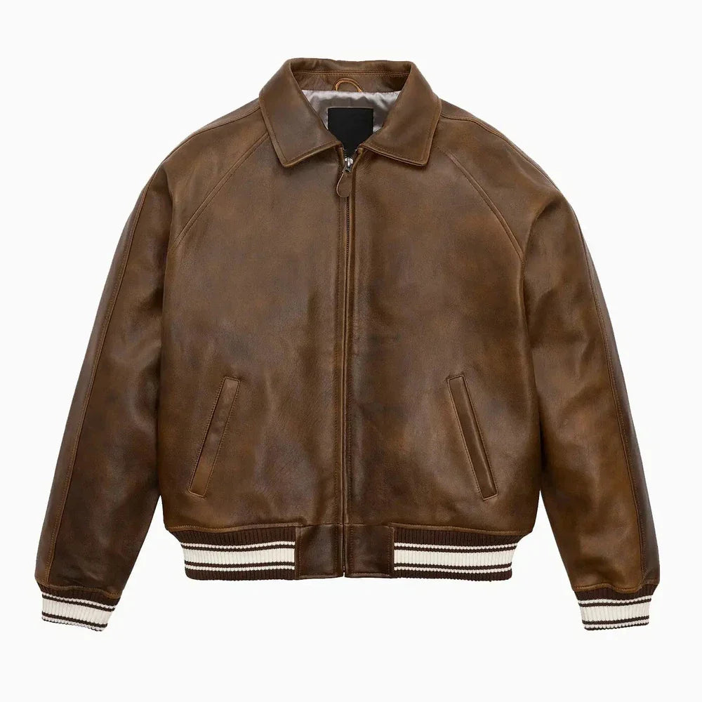 Brown leather jacket with white trim on a white background