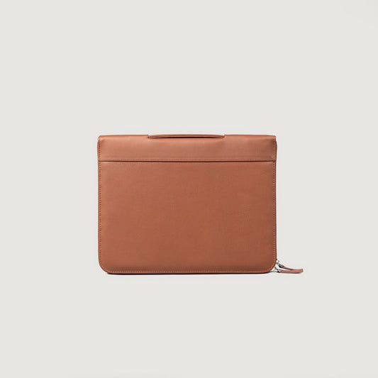 Brown leather pouch on a light gray background