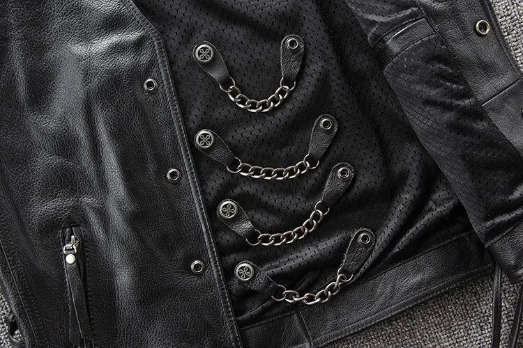 Close-up of a black leather jacket with chain details