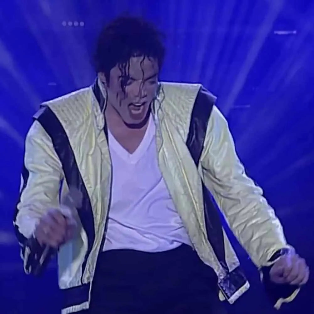 Person in a white jacket with black accents on a blue background