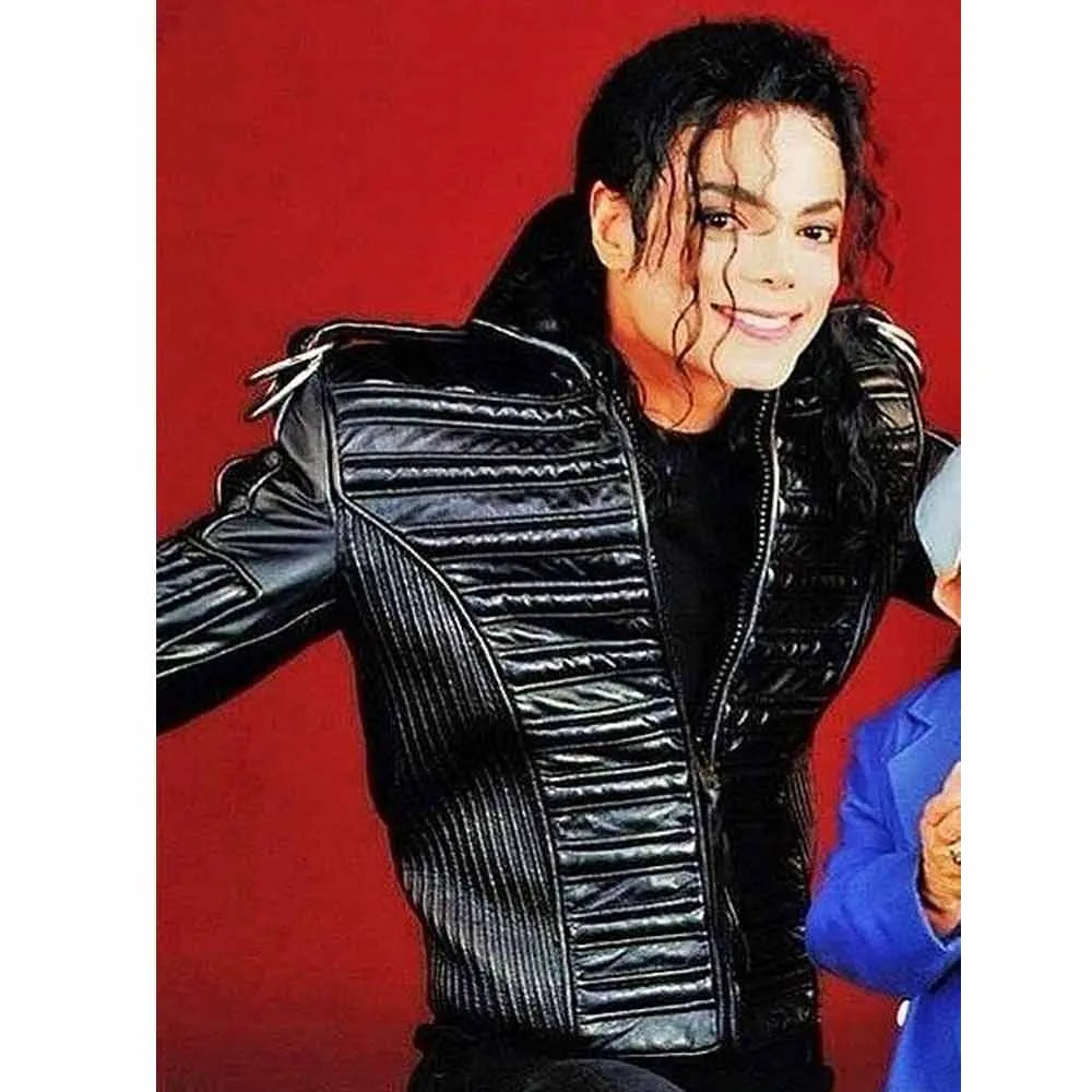 Person wearing a black leather jacket against a red background