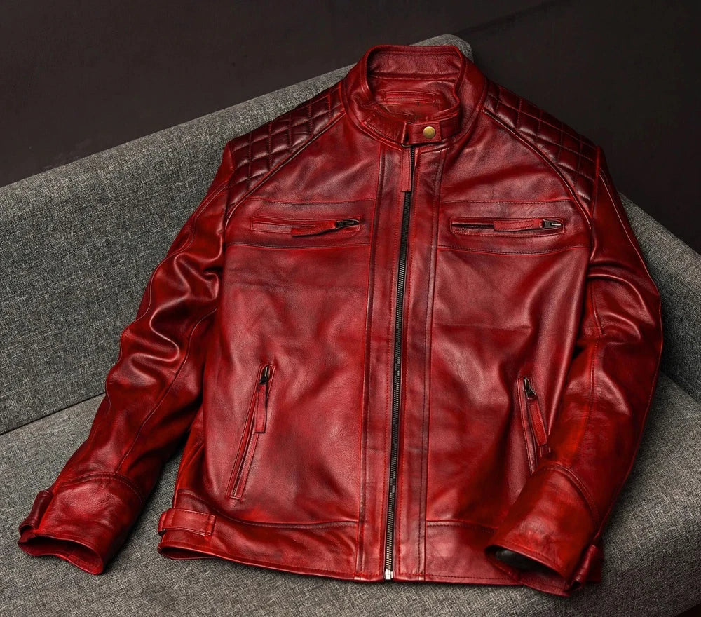 Red leather jacket on a gray surface with a dark background