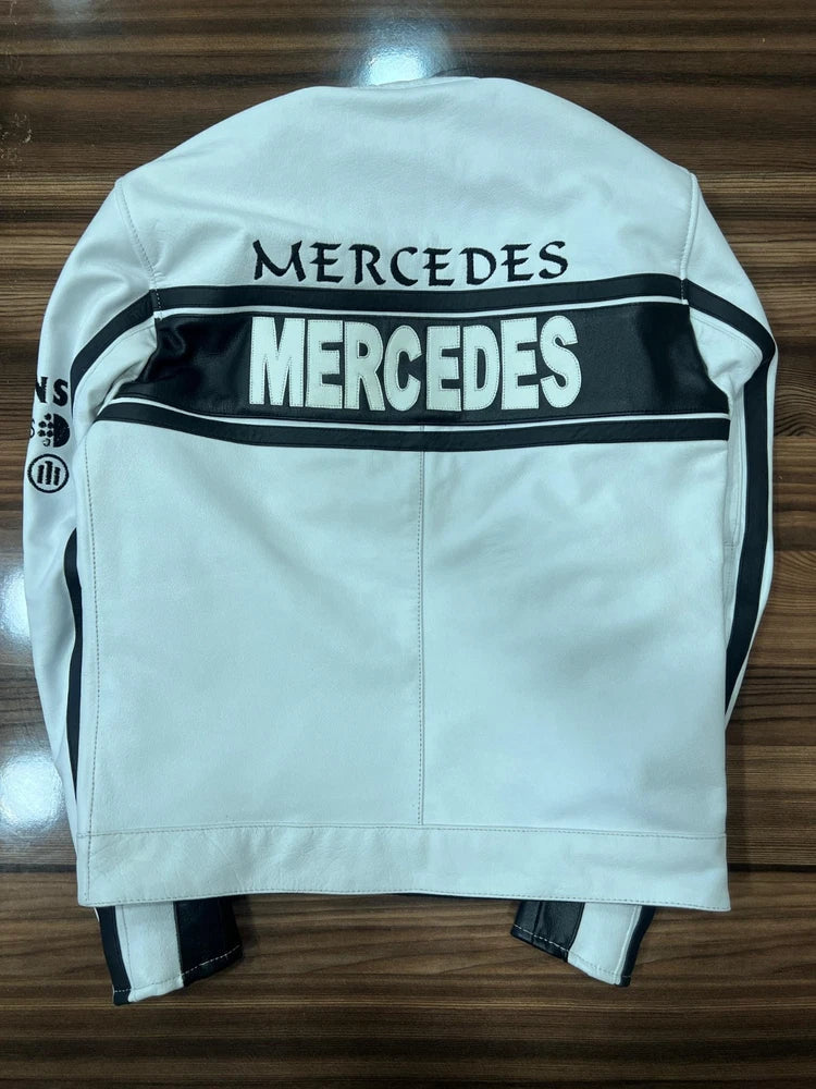 White jacket with Mercedes branding on a wooden surface